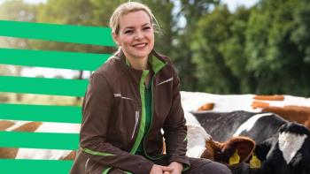 portrait of a woman farmer next to her cows