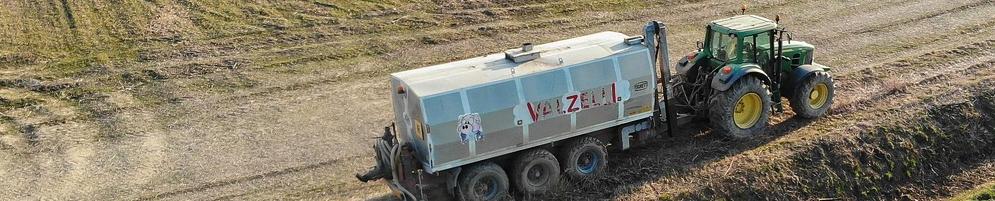 tractor spreading fertilisers in a field