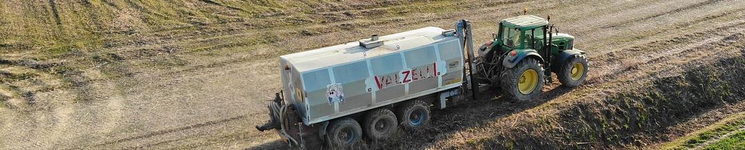 tractor in a field during distributing fertilisers