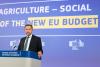 Cssr Hansen speaking in front of a backdrop displaying the texts NEW EU BUDGET